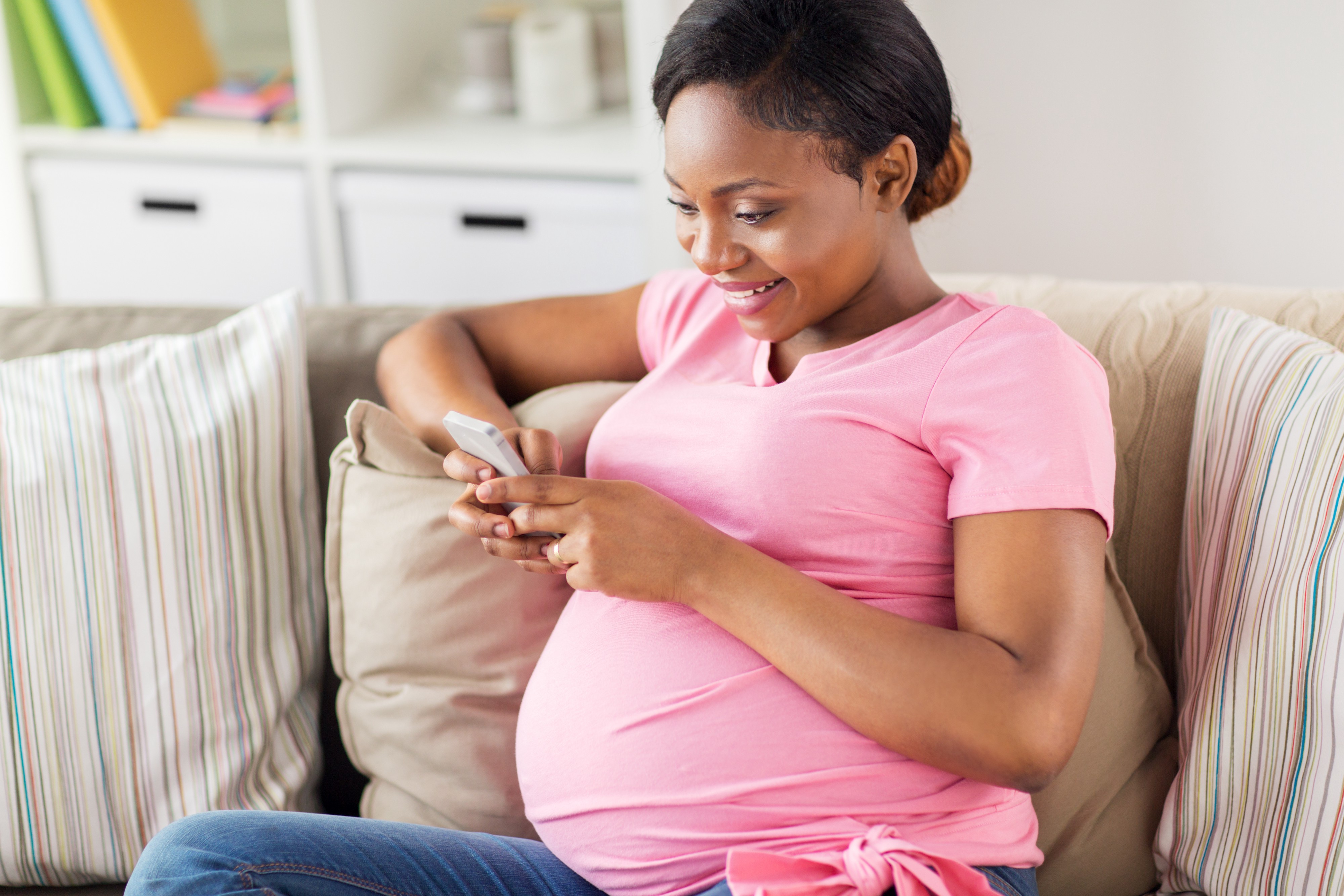 Pregnant patient using smart phone