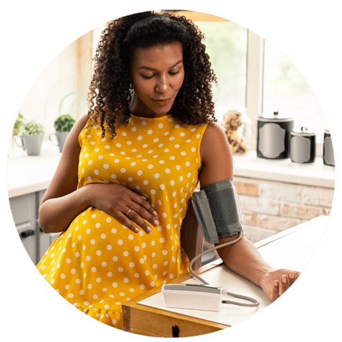 Pregnant patient taking blood pressure with BP cuff Pregnant patient taking blood pressure with BP cuff