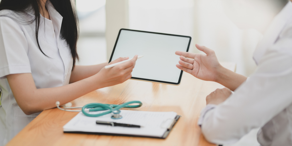 Doctor and nurse using tablet